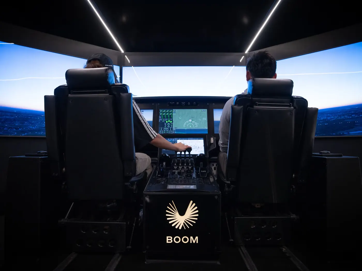 Pilots in the Boom flight simulator