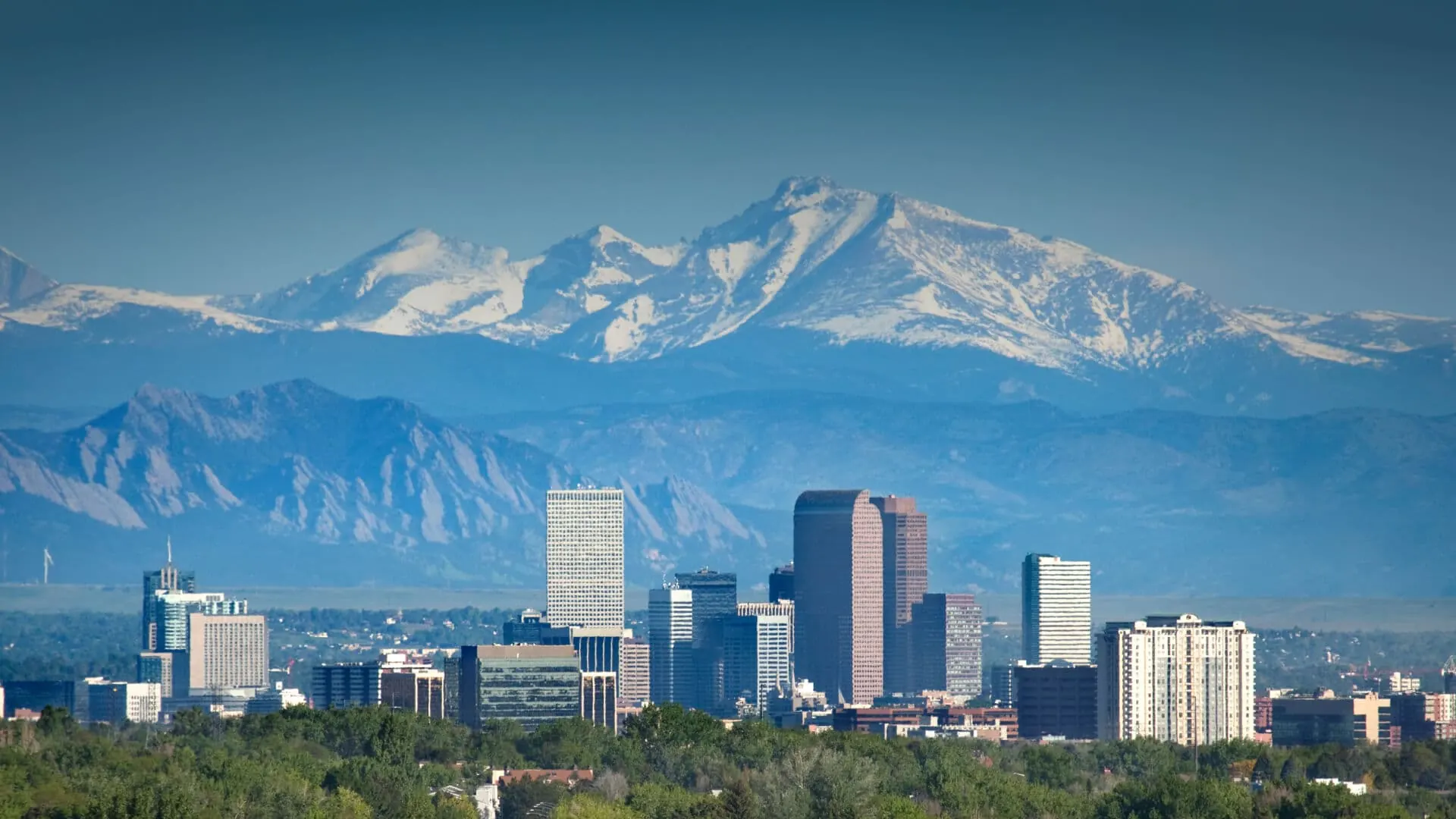 The Denver skyline in front of the Rocky Mountains